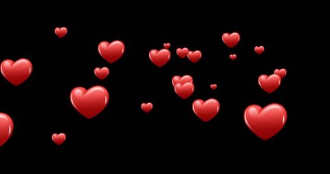 Floating Red Heart Icons on Black Background