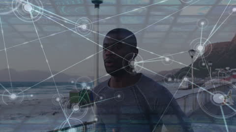 Person Running by Beach with Digital Network overlay