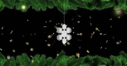 White hexagon snowflake ornament hanging on cord with evergreen border and gold confetti