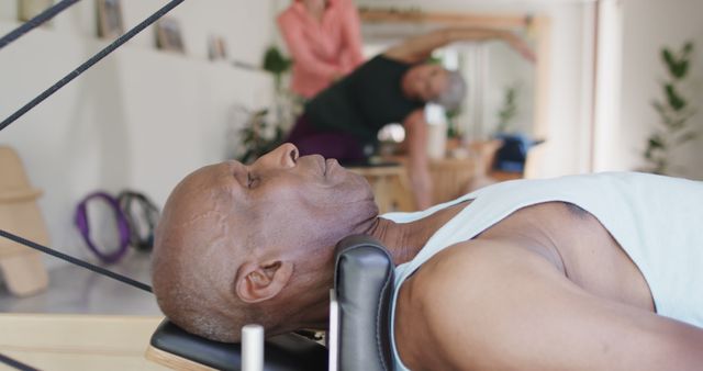 Senior Man Practicing Pilates Reformer Exercising at Gym - Download Free Stock Images Pikwizard.com