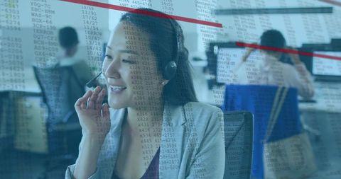 Smiling asian customer service agent adjusting headset at call center with data overlay