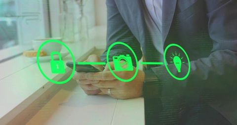 Business Professional Examining Cybersecurity Icons on Smartphone