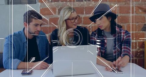 Diverse team collaborating at modern startup meeting