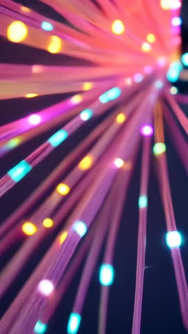 Vertical video panning through neon fiber-optic light bundle with glowing bokeh tips