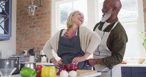 Happy Senior Couple Preparing Meal Together in Home Kitchen - Download Free Stock Images Pikwizard.com