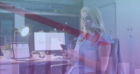 Businesswoman Analyzing Data on Smartphone in Modern Office