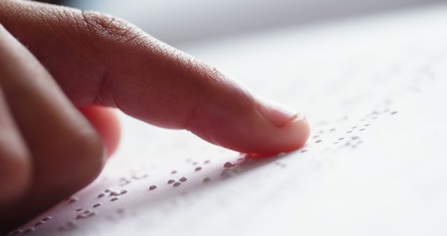 Close-up of Finger Reading Braille Text on White Paper - Download Free Stock Images Pikwizard.com