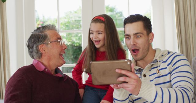 Three Generations Family Enjoying Tablet Together at Home - Download Free Stock Images Pikwizard.com