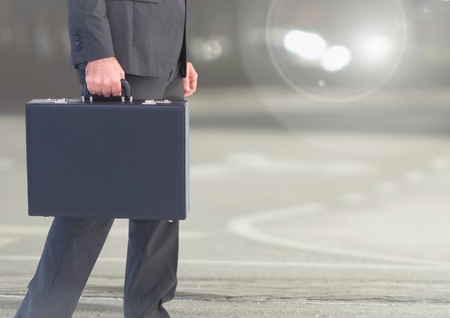Businessman walking with briefcase on road in city. Suggests themes of business travel, professional commuting, and corporate journeys. Ideal for illustrating business, finance, corporate lifestyle, or mobility.