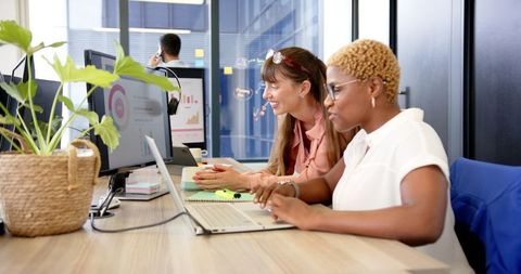 Two Women Collaborating on Project using Technology in Modern Office - Download Free Stock Images Pikwizard.com