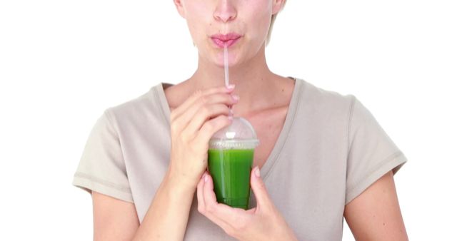 Young Woman Drinking Green Smoothie from Takeaway Cup - Download Free Stock Images Pikwizard.com