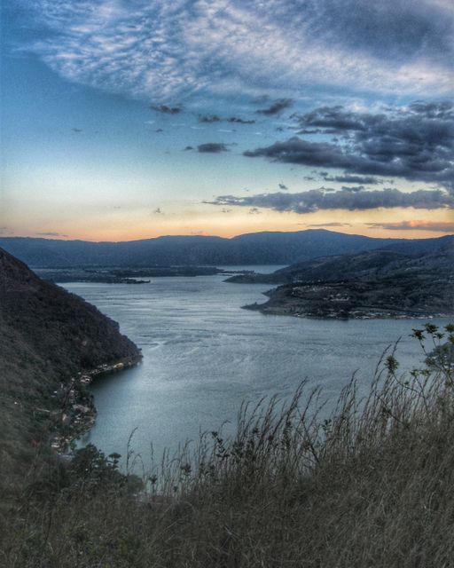 Serene Twilight Scenery Over Tranquil Lake and Rolling Hills - Download Free Stock Images Pikwizard.com