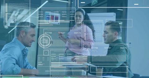 Business team analyzing digital data in modern conference room