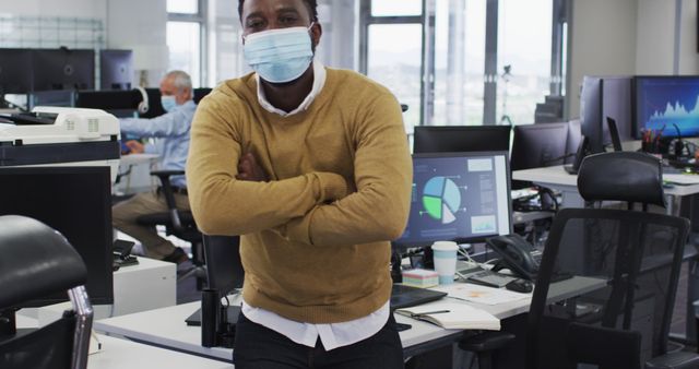 Confident Professional Wearing Mask in Modern Office Environment - Download Free Stock Images Pikwizard.com