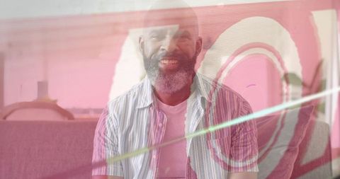 Smiling man relaxing on sofa with pink artistic overlay rings modern home lounge