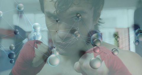 Mid-adult boxer holding red hand wraps toward camera with molecular network overlay