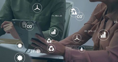 Business Team Using Digital Interface to Analyze CO2 Data