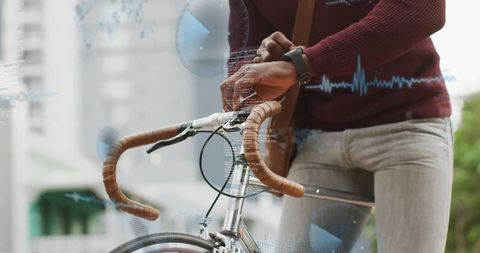 Urban Cyclist Adjusting Smartwatch While Holding Handlebars