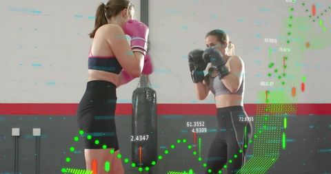 Two Women Sparring in Boxing Gym, Wearing Gloves and Gymwear, Digital Performance Overlay