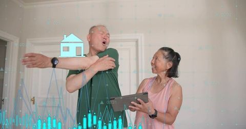 Senior man stretching shoulder with caregiver holding tablet and health analytics overlay