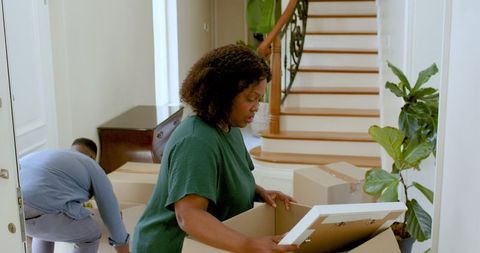 Couple unpacking and decorating new home together