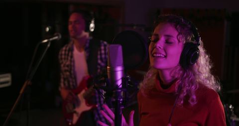 Female Singer and Guitarist Recording Melodic Beats at Studio - Download Free Stock Images Pikwizard.com