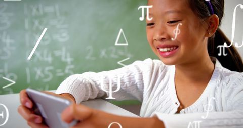 Asian Girl Engaging with Educational Symbolic Learning - Download Free Stock Images Pikwizard.com