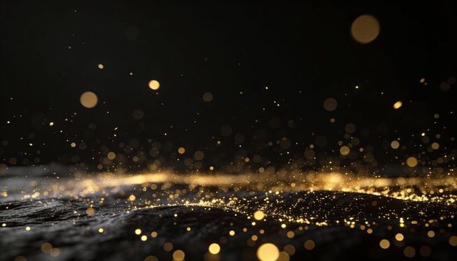 Scattering golden glitter across textured dark surface with soft bokeh lights