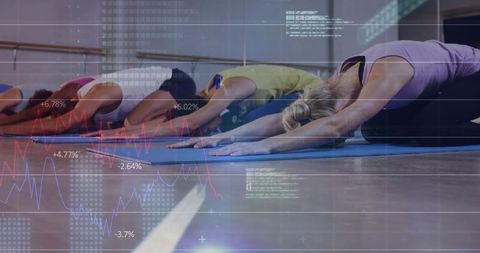 Diverse yoga class practicing child's pose on blue mats with data overlay for health analytics
