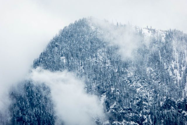 Snow-Covered Mountain Peak in Misty Weather - Download Free Stock Photos Pikwizard.com