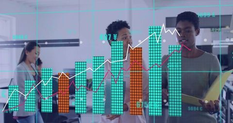 Businesswomen Analyzing Digital Graphs in Modern Office