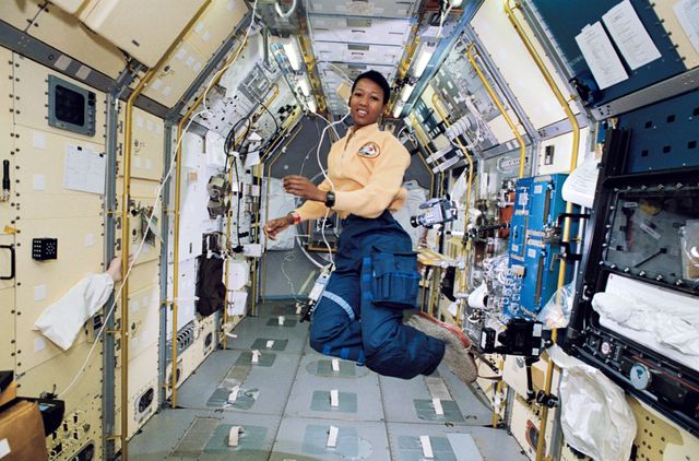 STS047-37-003 (12-20 Sept. 1992) --- Astronaut Mae C. Jemison, STS-47 mission specialist, appears to be clicking her heels in zero-gravity in this 35mm frame photographed in the Science Module aboard the Earth-orbiting Space Shuttle Endeavour. Making her first flight in space, Dr. Jemison was joined by five other NASA astronauts and a Japanese payload specialist for eight days of research in support of the Spacelab-J mission, a joint effort between Japan and the United States.