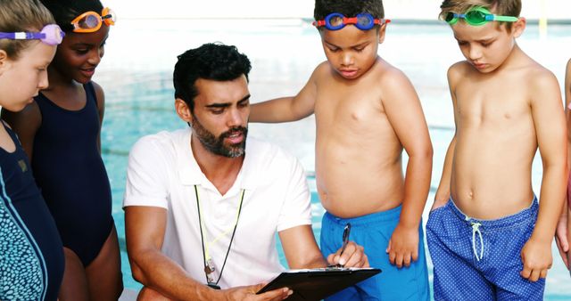 Swim Instructor Coaching Children at Poolside Lesson - Download Free Stock Images Pikwizard.com