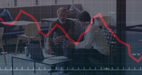 Colleagues analyzing financial data overlay in modern office