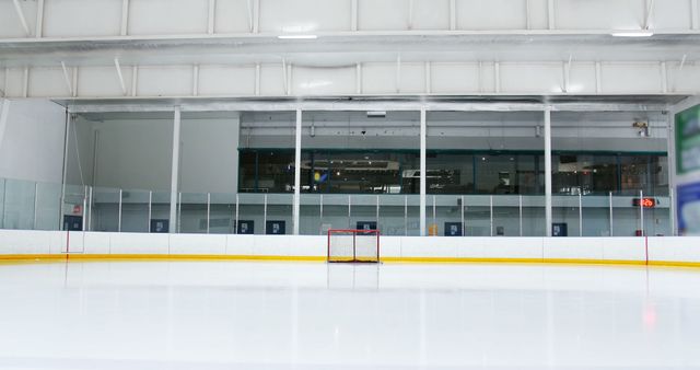 Perfect for use in sports-related content, advertisements for ice hockey rinks, training centers, and athletic facilities. Suitable for showcasing the tranquility of an empty sports facility before a game or practice session.