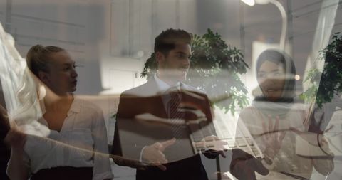 Innovative Business Discussion with Diverse Team Reflecting Growth