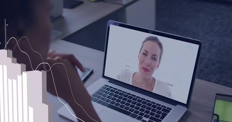 Remote colleague collaborating via laptop video call with analytics overlay and office desk