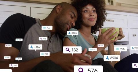 Relaxed couple amidst social media interactions at home