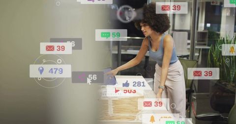 Professional woman interacting with augmented analytics while organizing manila folders