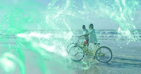 Cyclists Enjoying Beachfront Ride With Vibrant Digital Network Overlay