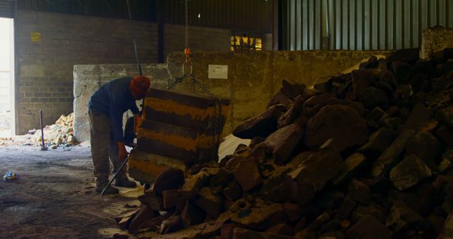 Worker Handling Large Stone Blocks in Industrial Warehouse - Download Free Stock Images Pikwizard.com