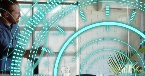 Man Presenting With Turquoise HUD Overlay in Bright Loft Workspace for Team Collaboration