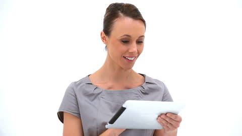 Smiling Woman Using Tablet Technology in White Studio