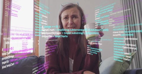 Woman contemplating code work in cozy living room environment