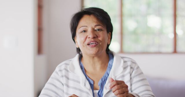 Mature Woman in Striped Sweater in Home Living Room - Download Free Stock Images Pikwizard.com