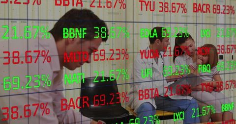 Healthcare professionals analyzing medical data in waiting room