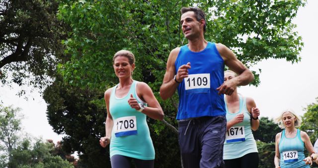 Caucasian adults compete in a marathon, displaying athleticism and resolve. - Download Free Stock Photos Pikwizard.com