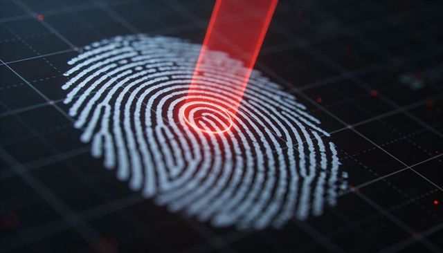 Red laser scanning fingerprint on futuristic biometric sensor grid for secure authentication