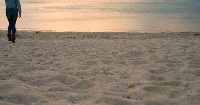 Person Walking on Sandy Beach at Sunset - Download Free Stock Images Pikwizard.com