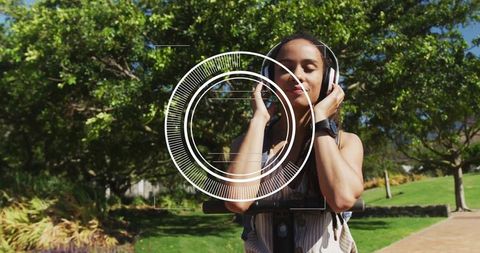 Woman Enjoys Music on Scooter in Sunny Park
